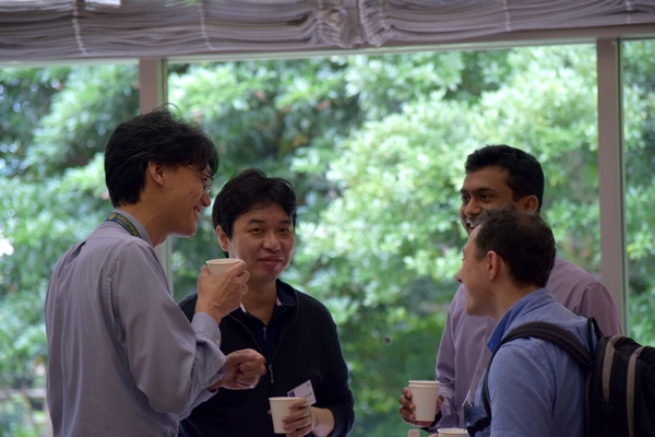 photo: August 2 (Tuesday), Friendly discussion during a break in the Economic Development session